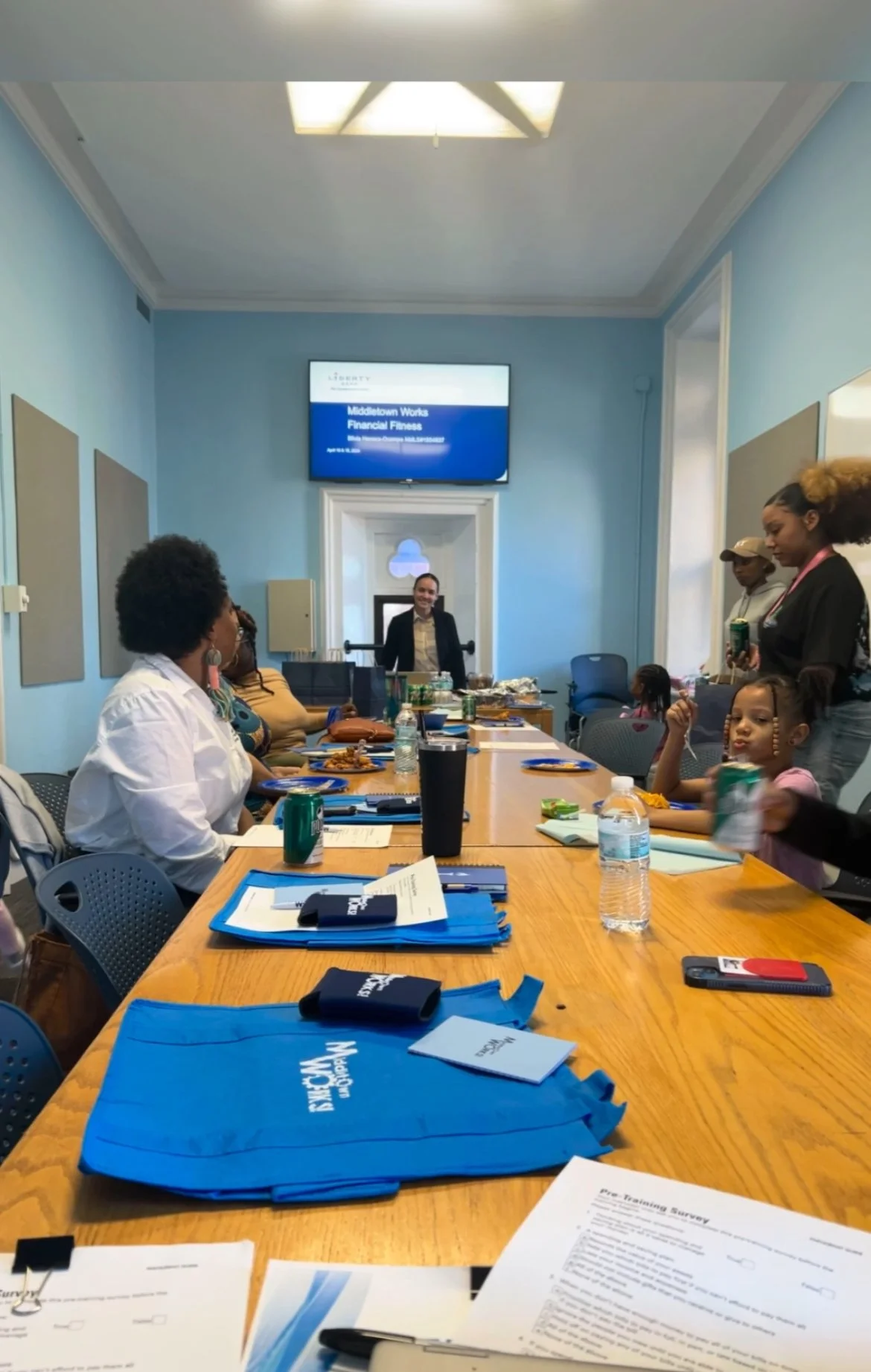 Parents participating in a Middletown Works financial empowerment workshop led by our Liberty Bank board partner.