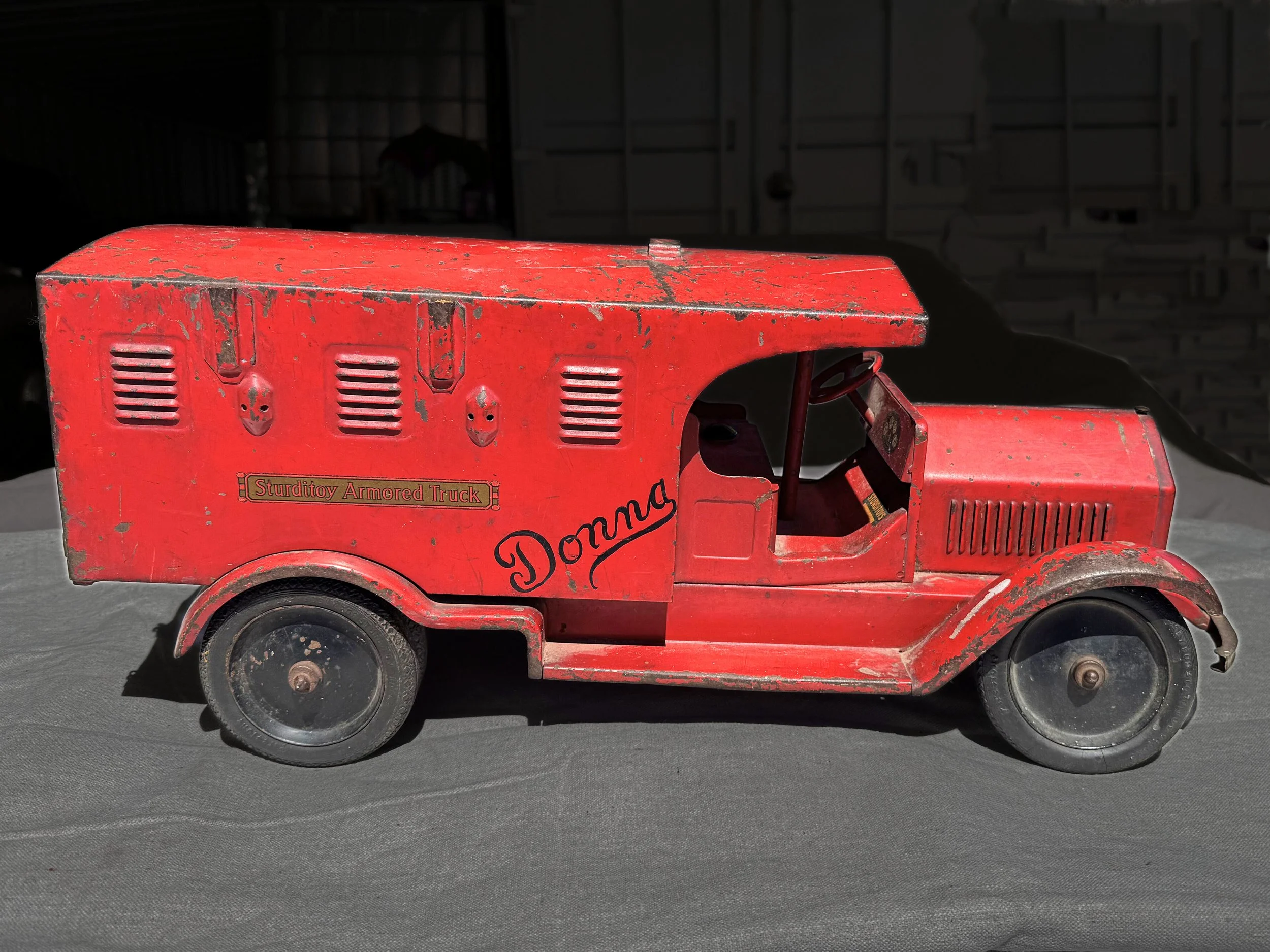 Discovered 03/2026 a Ride On version of the Armored Car.  It has provisions for a slide in seat, and steering handle.  It also has black painted wheel centers and dual wheels in the rear. Special thanks to Brian Miller for sharing this example.  