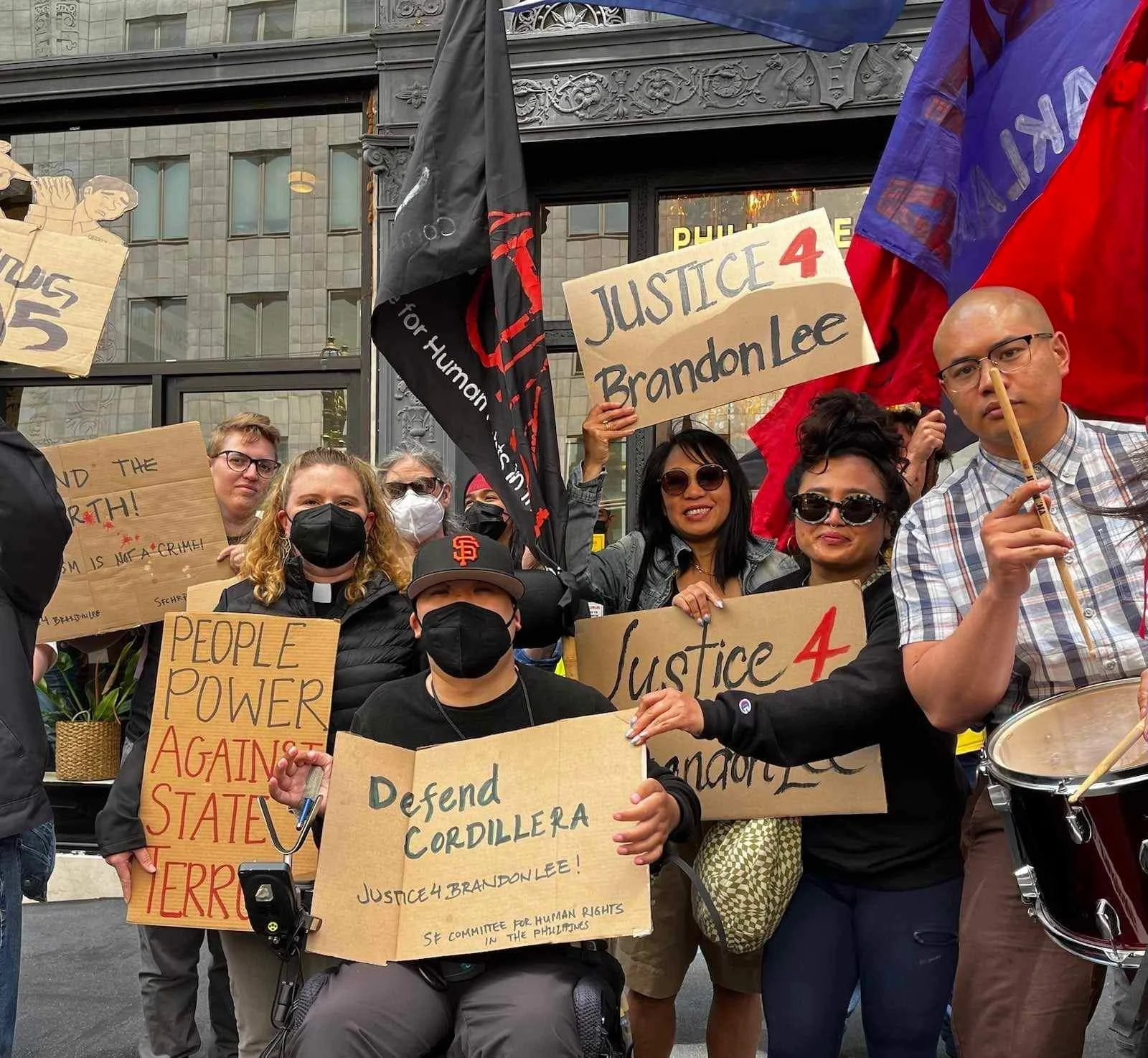 Brandon Lee with members from Bethany United Methodist Church at the People’s State of the Nation Address in July 2023. They held signs reading, “Defend Cordillera”, “Justice for Brandon Lee“, and “People Power Against State Terror“.