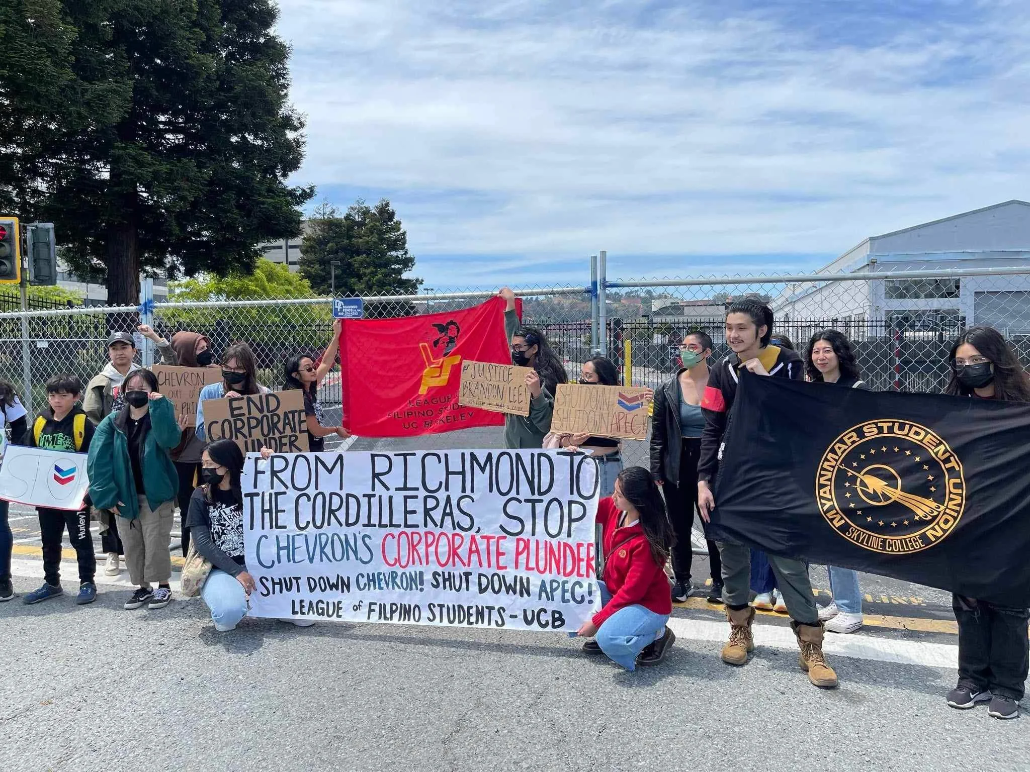 The League of Filipino Students at UC Berkeley at the 10th Global Anti Chevron Day holding a large banner stating, “From Richmond to the Cordillera, Stop Chevron’s Corporate Plunder! Shutdown Chevron! Shutdown APEC!”
