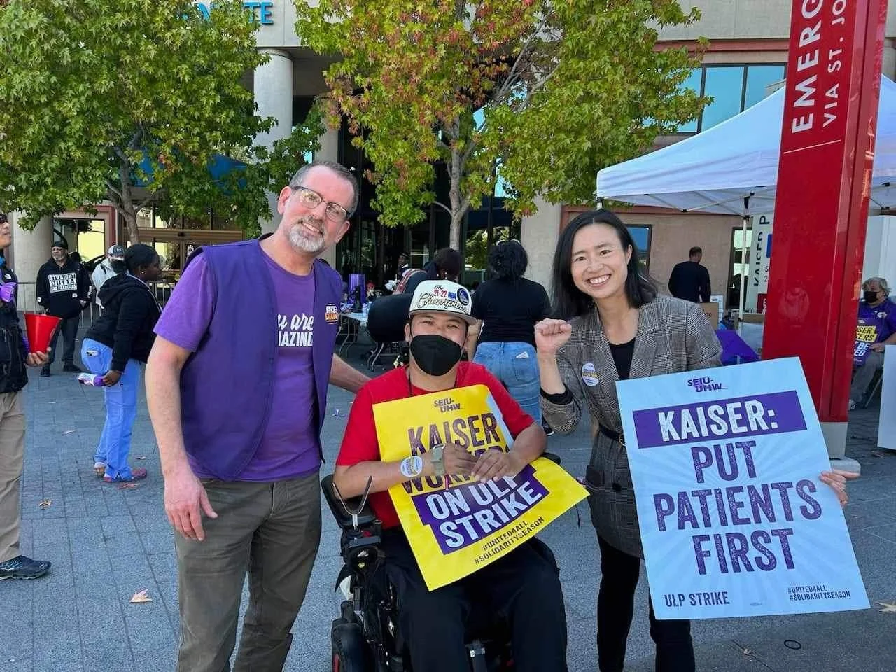 Brandon Lee supporting Kaiser Nurses Strike on Geary st with a shop steward and Richmond Supervisor Connie Chan in October 2023