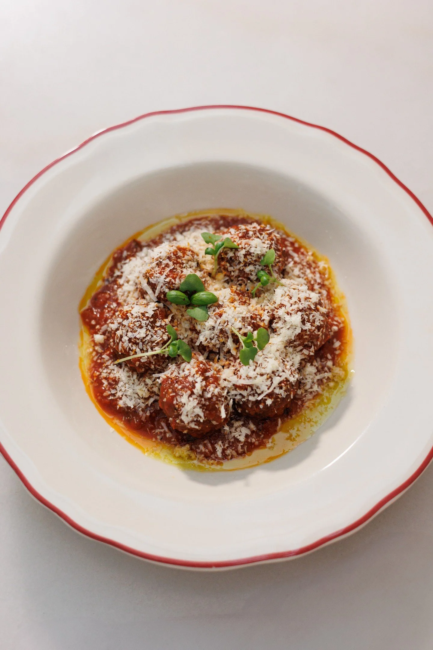 Tender pork and veal meatballs in rich sugo, finished with parmesan and basil.