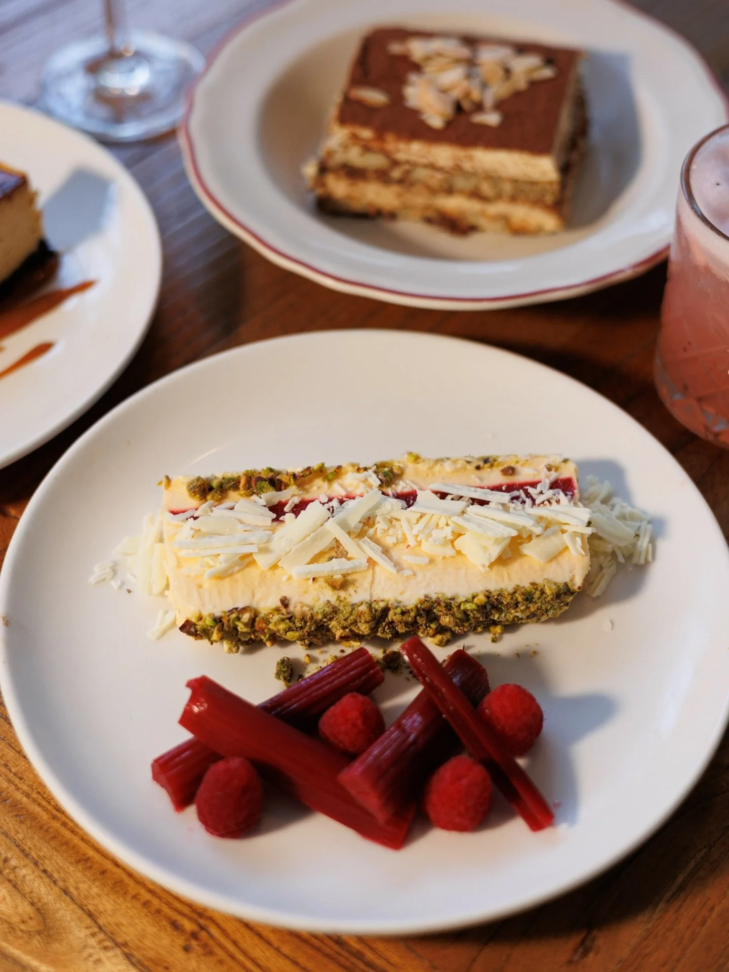 Sweet, smooth and a little indulgent.
White chocolate & raspberry semifreddo with poached rhubarb and pistachio crust.