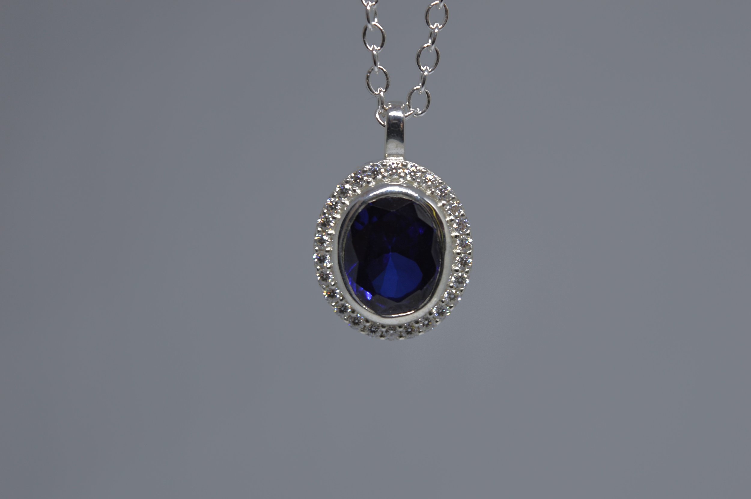 578 Sapphire pendant Hanging.jpeg