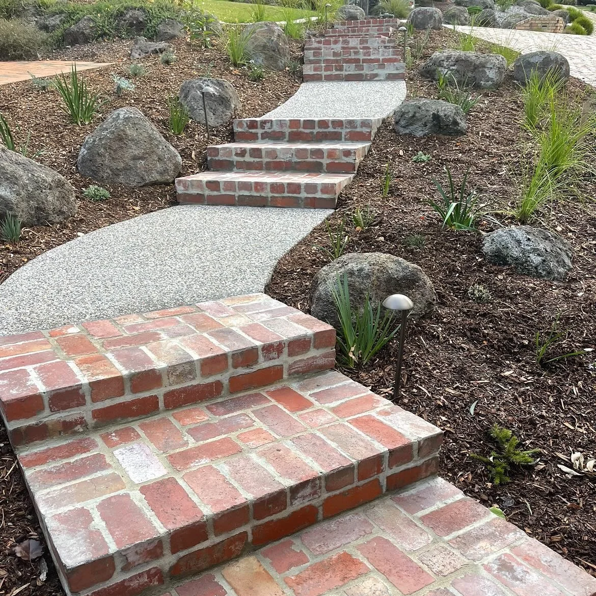 ✨ Project Spotlight &ndash; Eltham ✨

I&rsquo;m absolutely loving how these steps came together! We mixed recycled second-hand bricks with exposed aggregate to create stairs that feel timeless and full of character. The best part? They&rsquo;re nestl