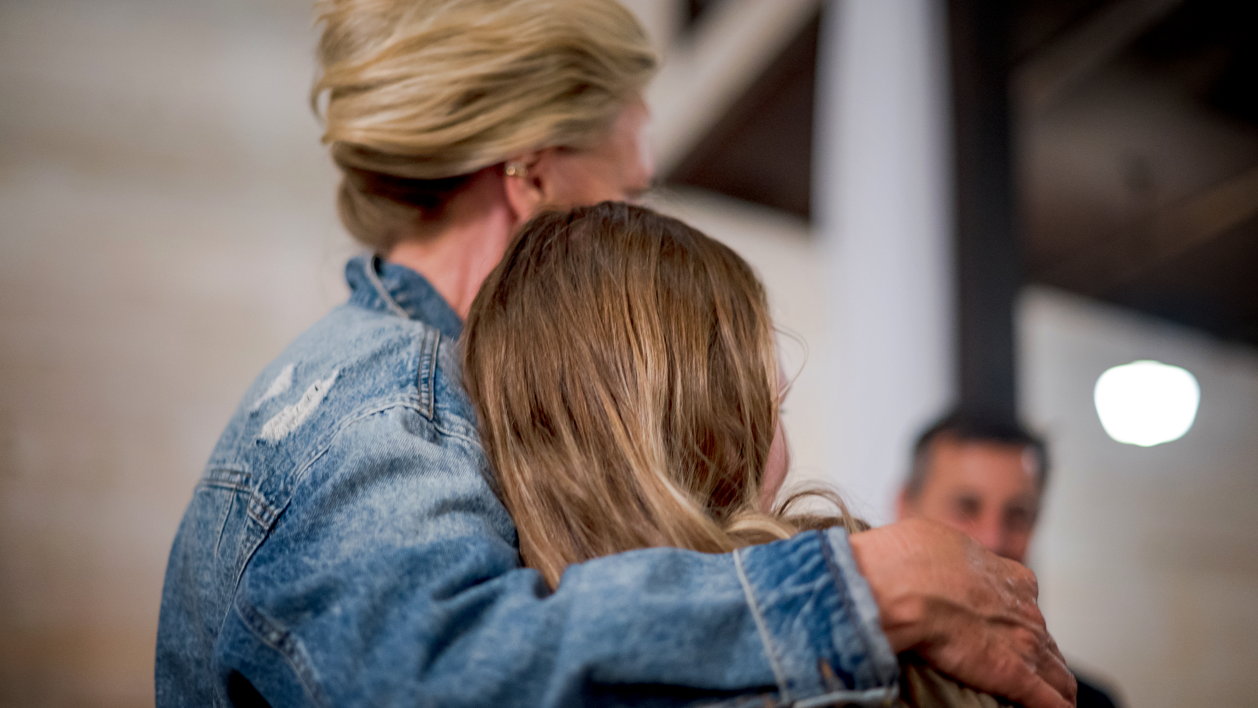 Erin Brockovich hugging a community member