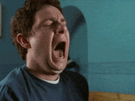 A young man yawning