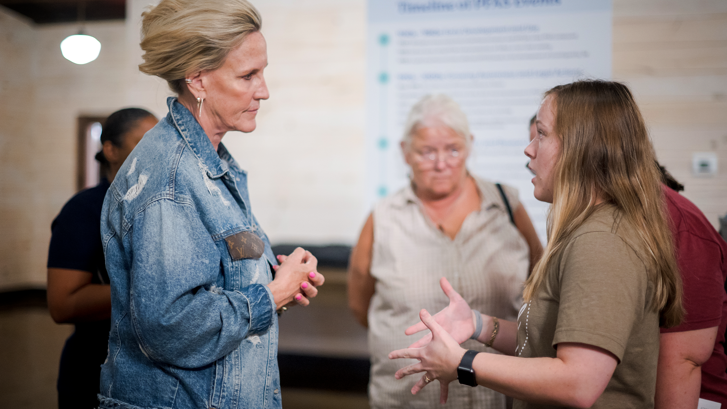 Erin Brockovich talking with local residents