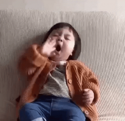 A toddler yawning