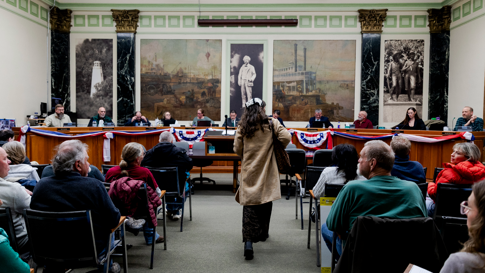 Residents at a packed city council meeting