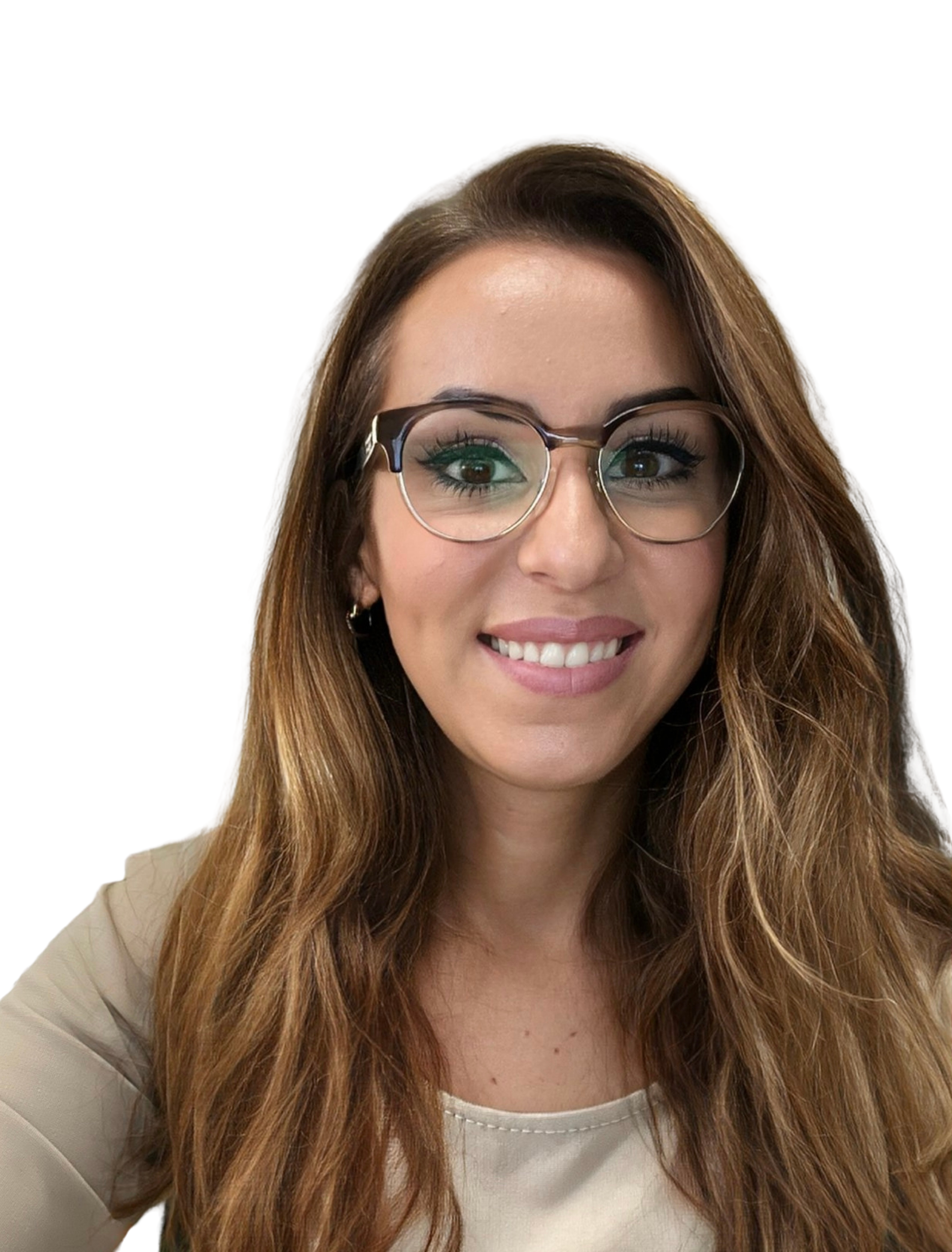 A woman with long, wavy brown hair, wearing glasses with round frames, smiling, wearing a light-colored top.