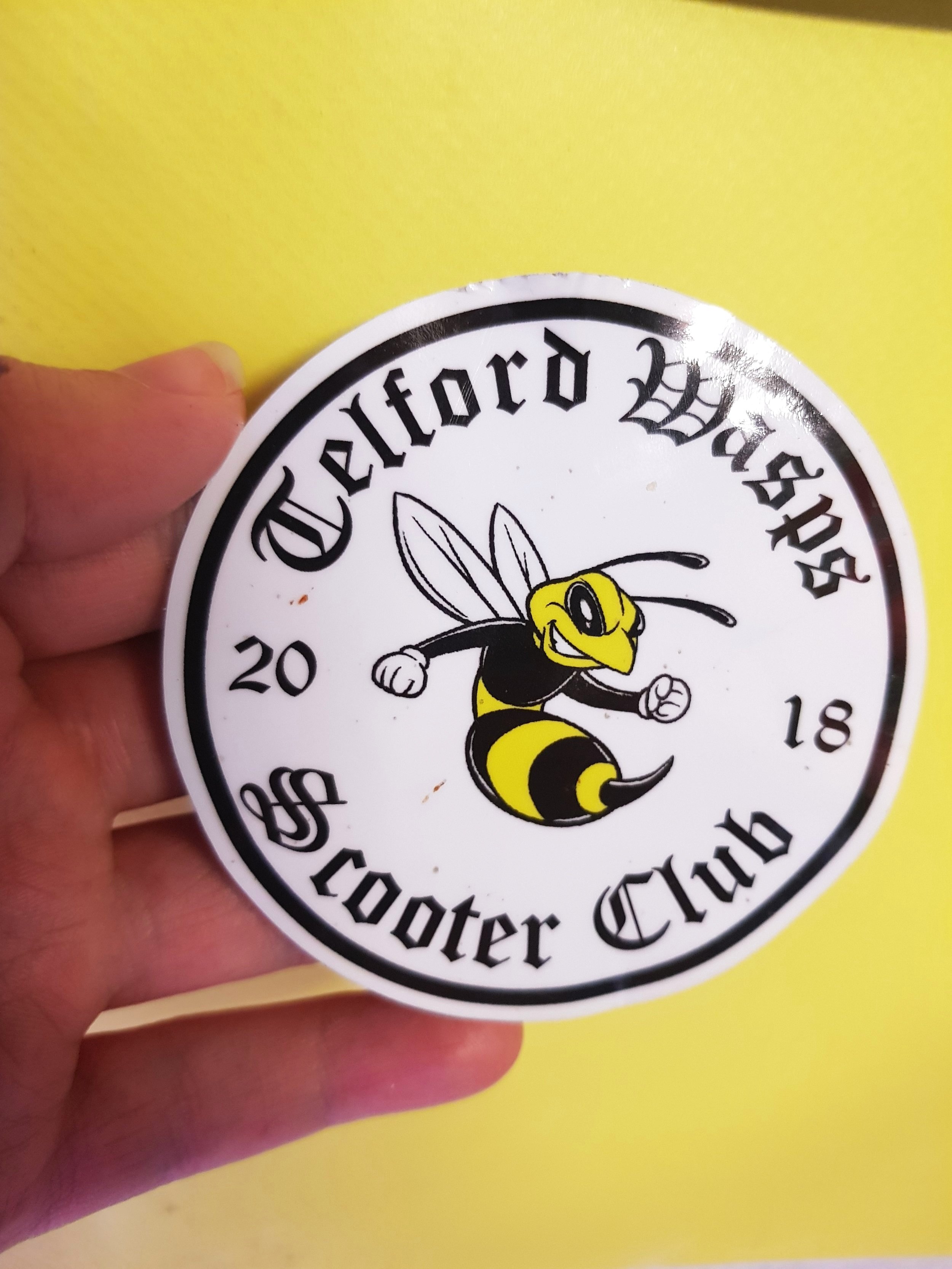 A close up of Telford Wasp Scooter Club waterproof sticker.