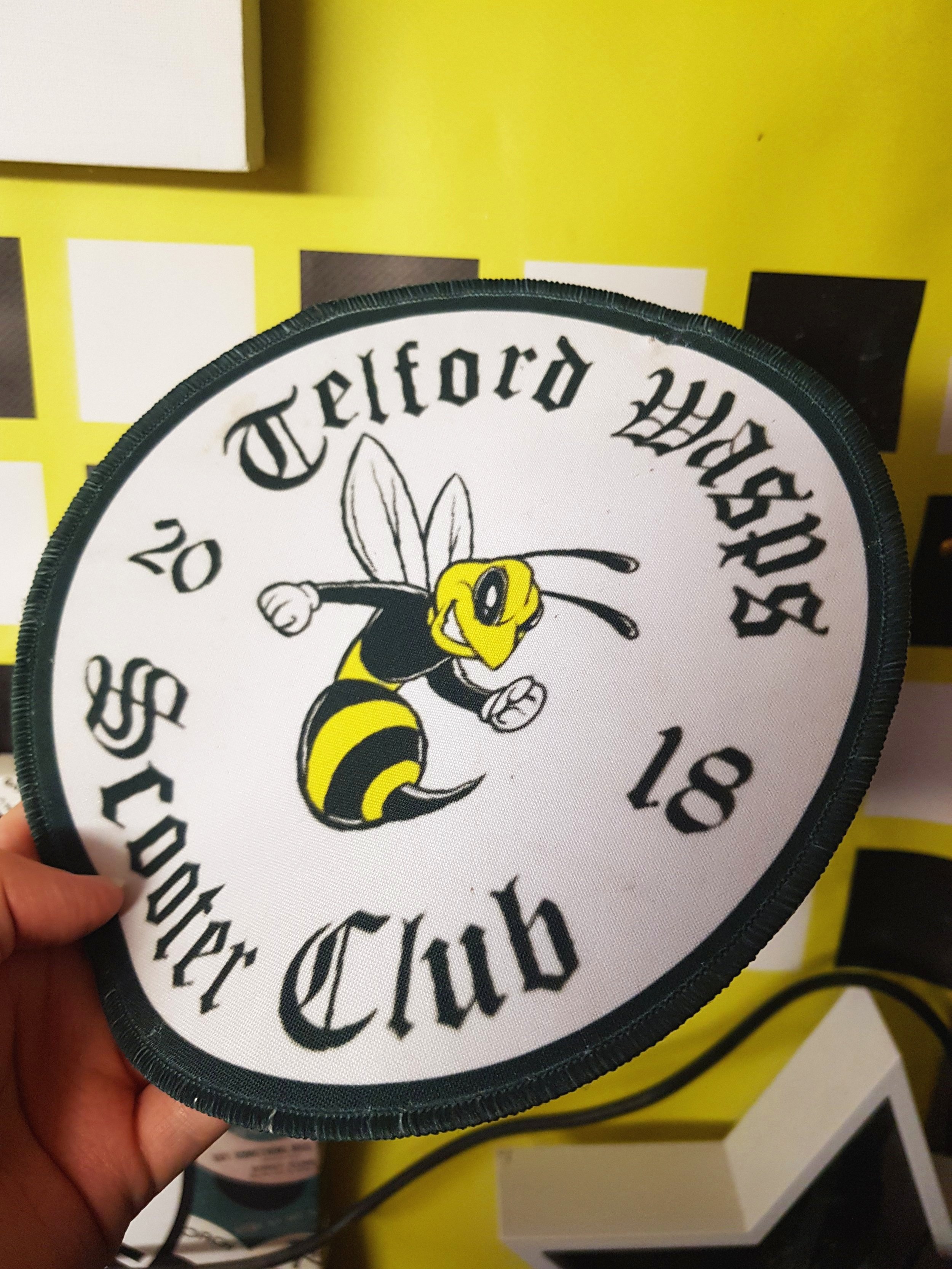 A close up of Telford Wasp Scooter Club iron-on patch.