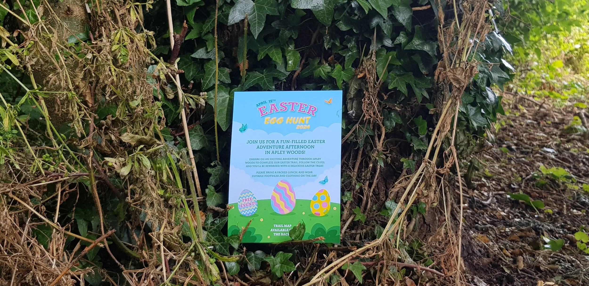 Front of Easter Egg Hunt 2024 flyer placed on a tree.