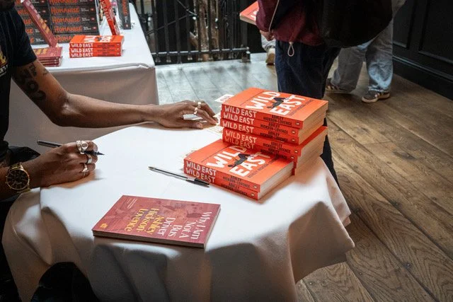 Ashley Hickson-Lovence signing his book Wild East.