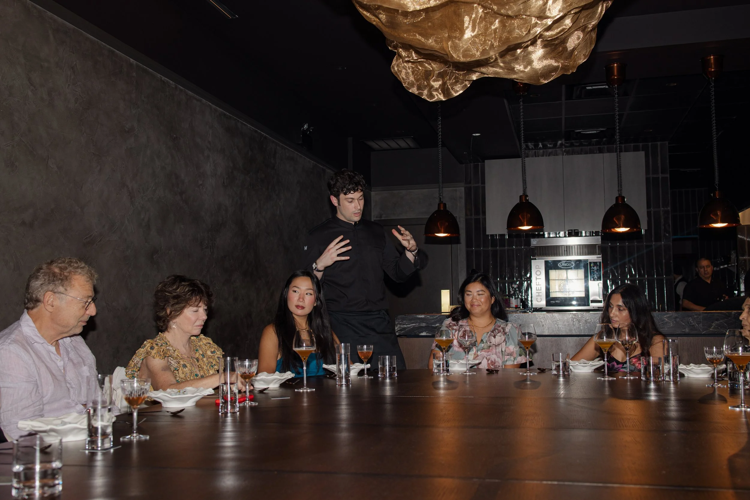 Class Act guests gathered around the communal table