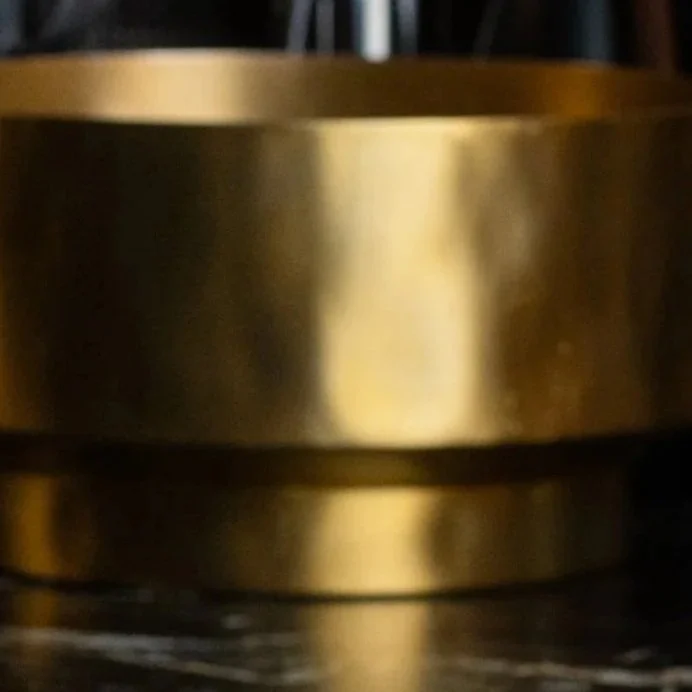 Close-up of a brass champagne bucket at Class Act.