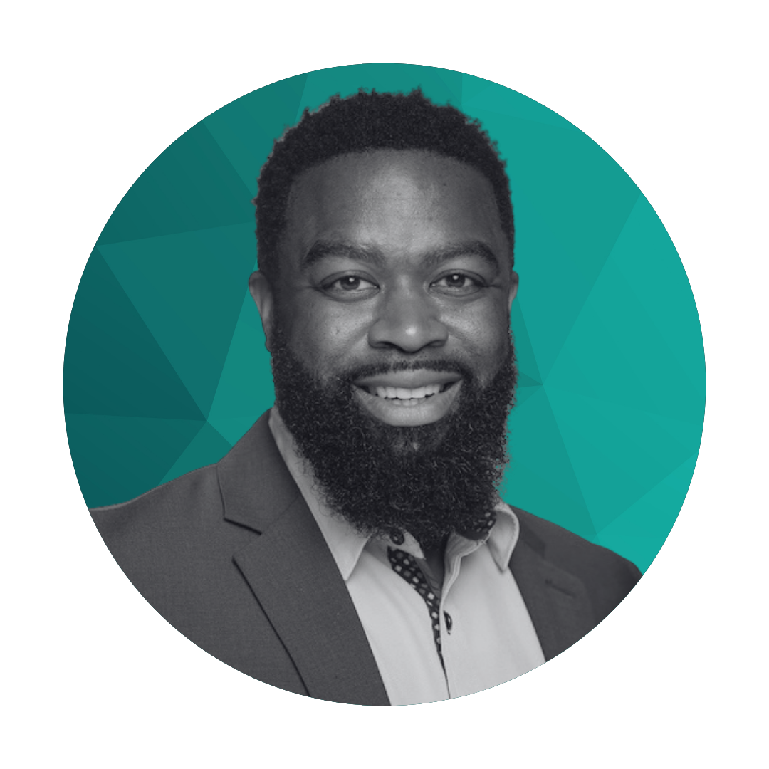 Black and white headshot of a smiling man with a beard, wearing a suit jacket and collared shirt, set against a teal geometric background.