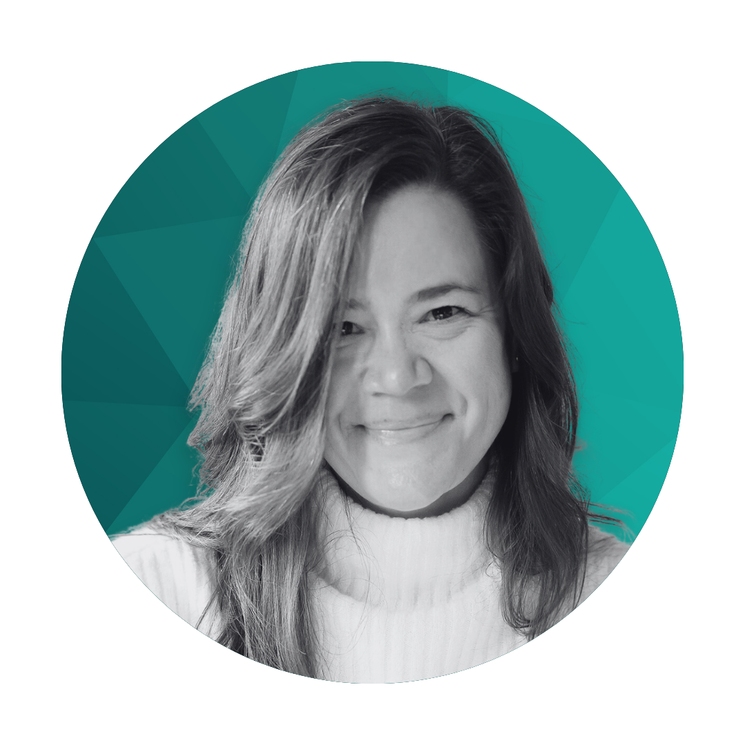 Black and white headshot of a smiling woman with shoulder-length hair wearing a light-colored top, positioned in front of a teal geometric background.