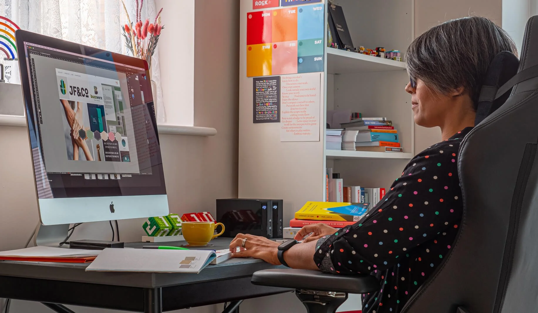 Brand identity designer Bhavini Lakhani working on a client brand identity at her desk