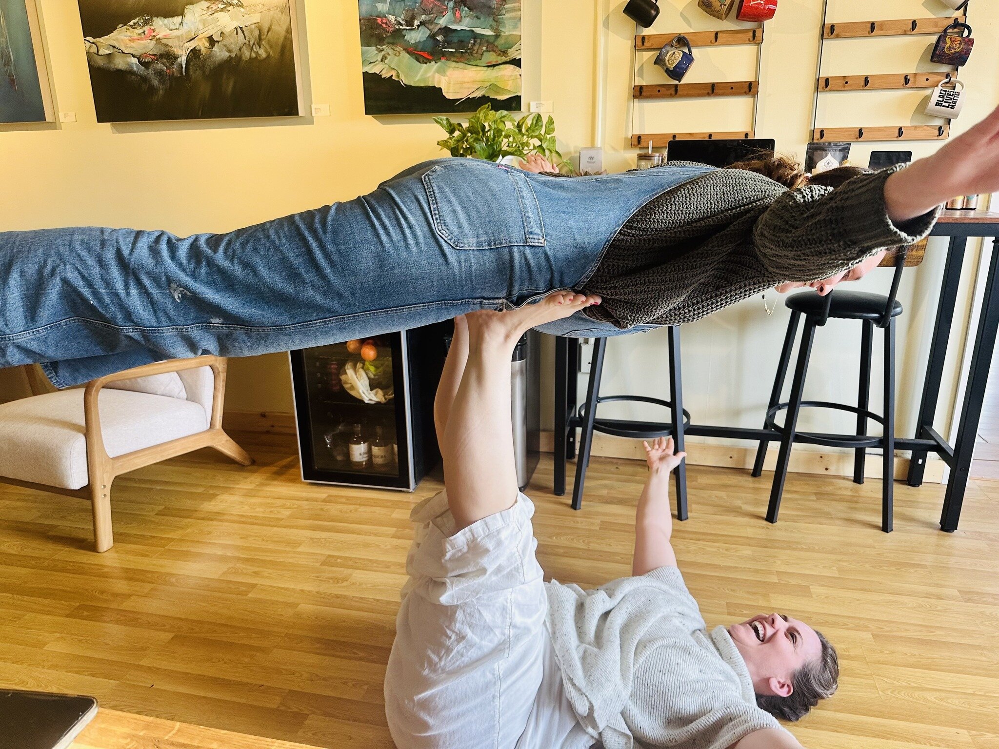 Studio Shenanigans! 🩵 
Just Sabrina &amp; Eden channeling their inner child, &quot;Eden do you want to fly?&quot; 😃 We hope everyone is having a great Thursday! 

#studiofun #shenanigans #yogastudio #flying #innerchild #playful #laughing