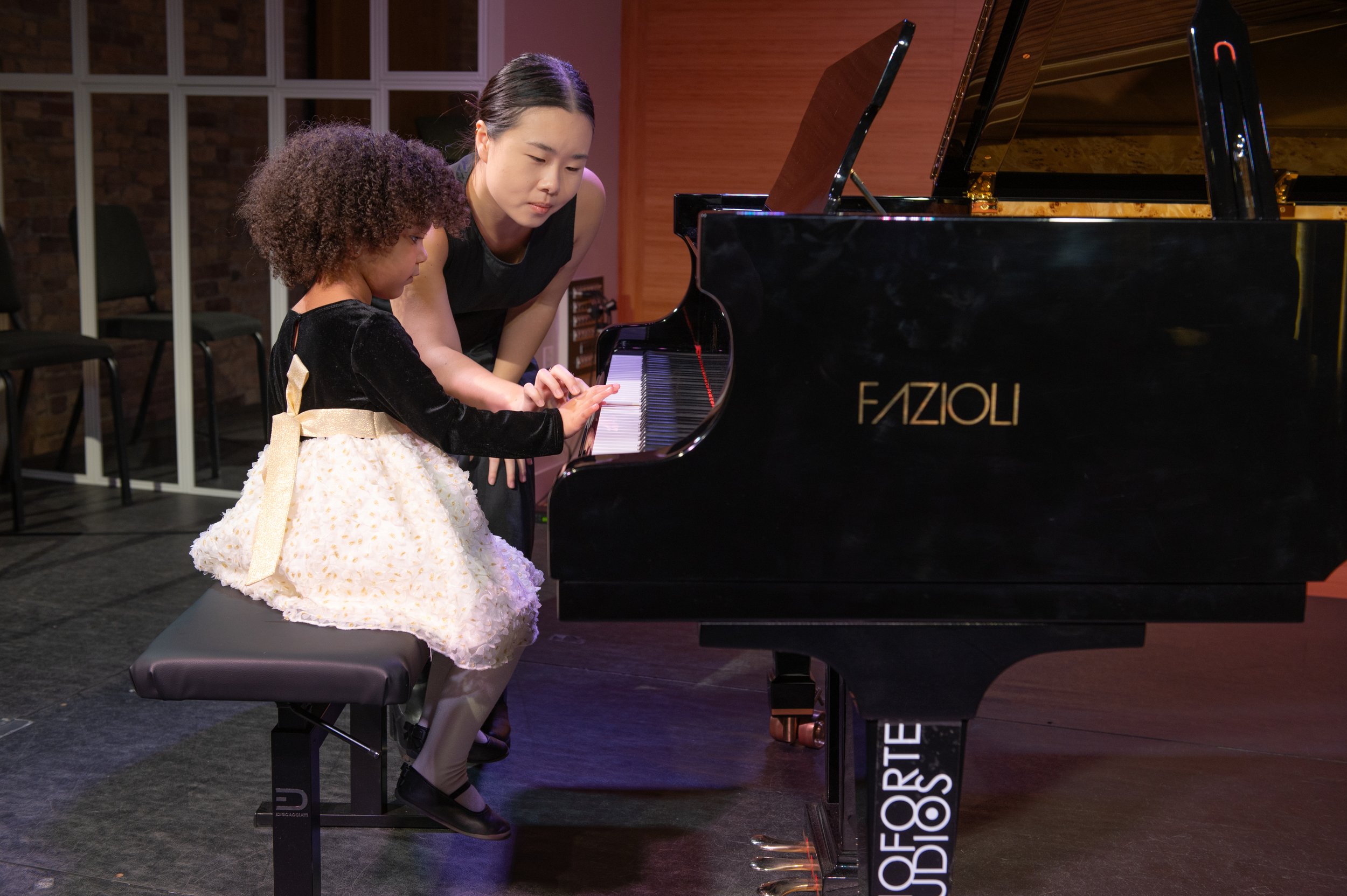 Jenny helping her student with her fingerings