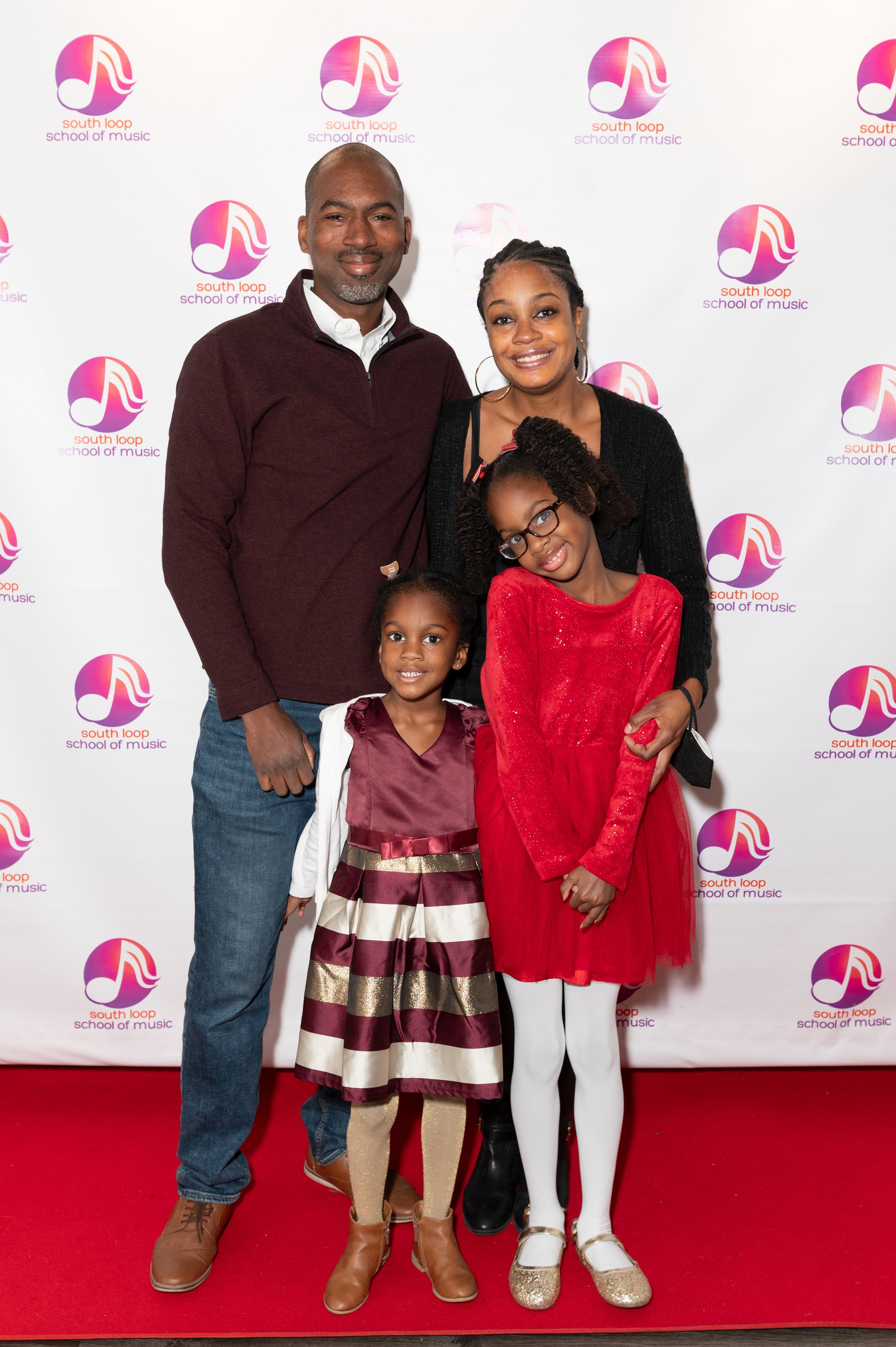 Family pictures are a must at the South Loop School of Music Winter Recital