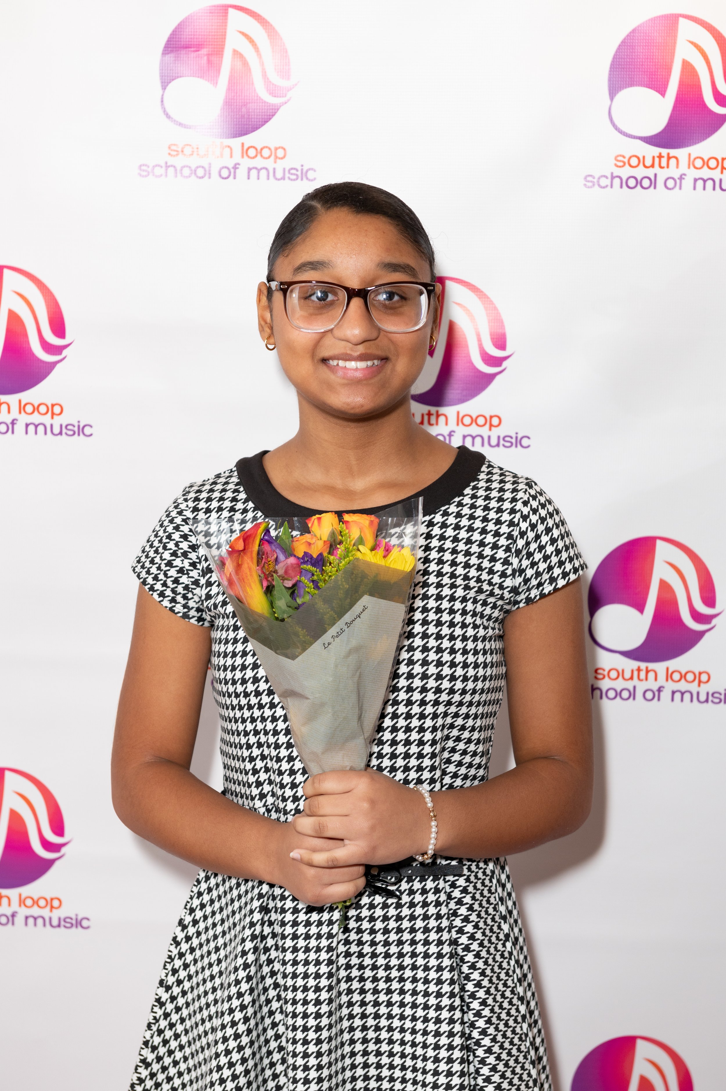 Flowers and smiles after a stellar performance at the 2023 Winter Recital