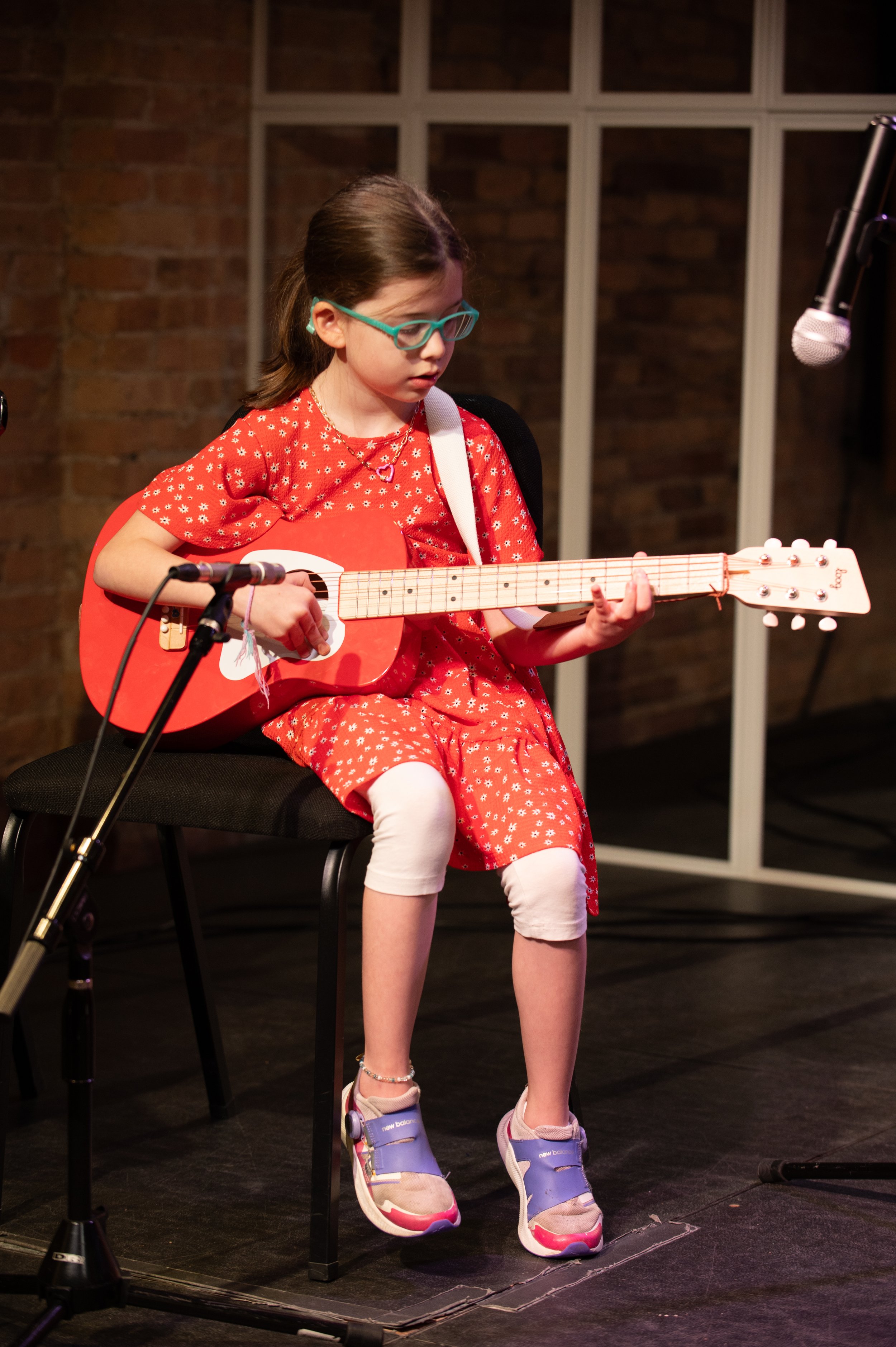 A strong guitar performance for this young girl