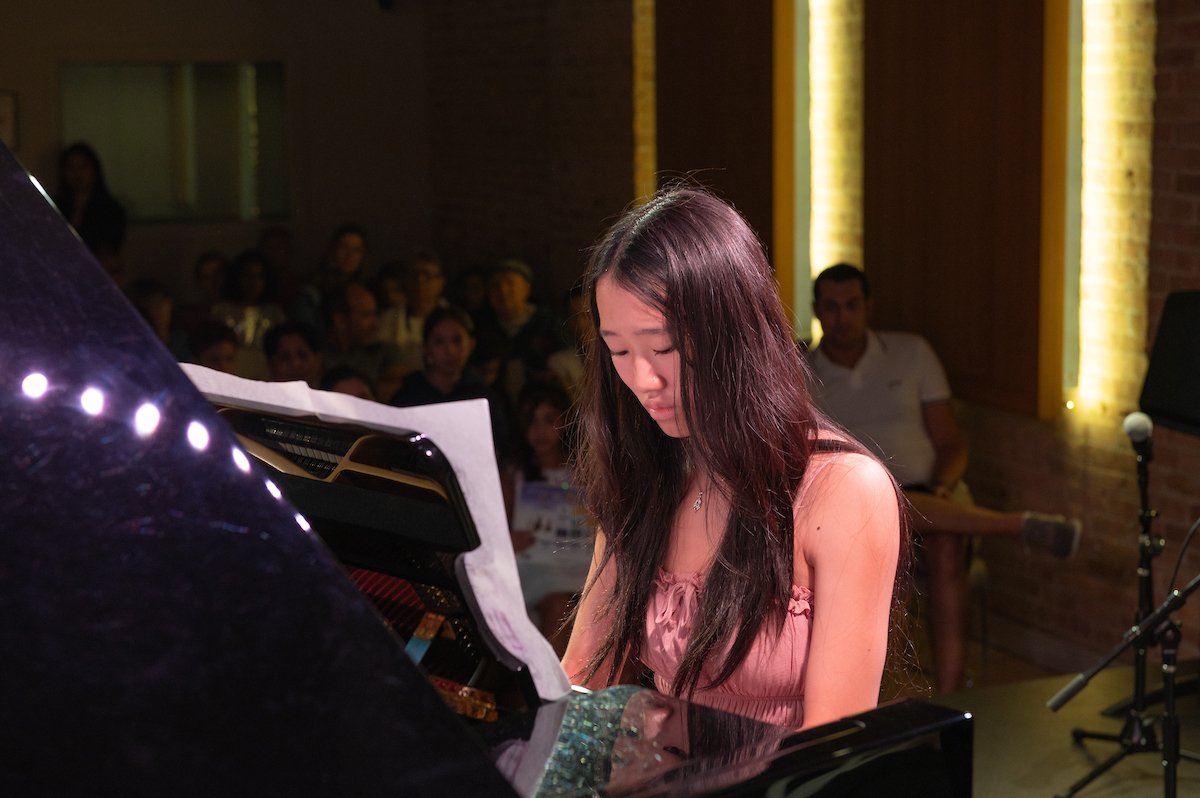 Anabelle playing piano at South Loop School of Music's summer 2023 recital