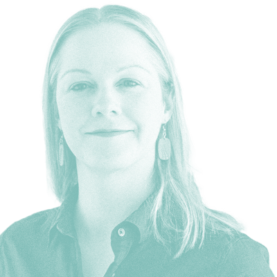 grainy teal monochrome photo of Greta Heathcote. She has long, light hair and is wearing earrings and a collared shirt