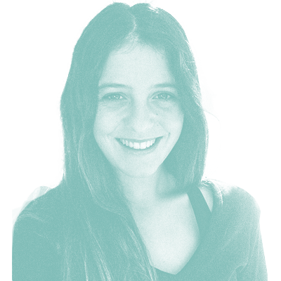 grainy teal monochrome photo of Garazi Casillas. She has long, dark hair and is smiling.
