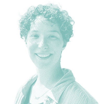 grainy teal monochrome photo of Noah Bloom. She has short, curly hair and is smiling