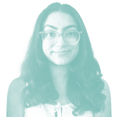 grainy teal monochrome photo of Ishnoor Nahal. She has long, dark, wavy hair and round glasses