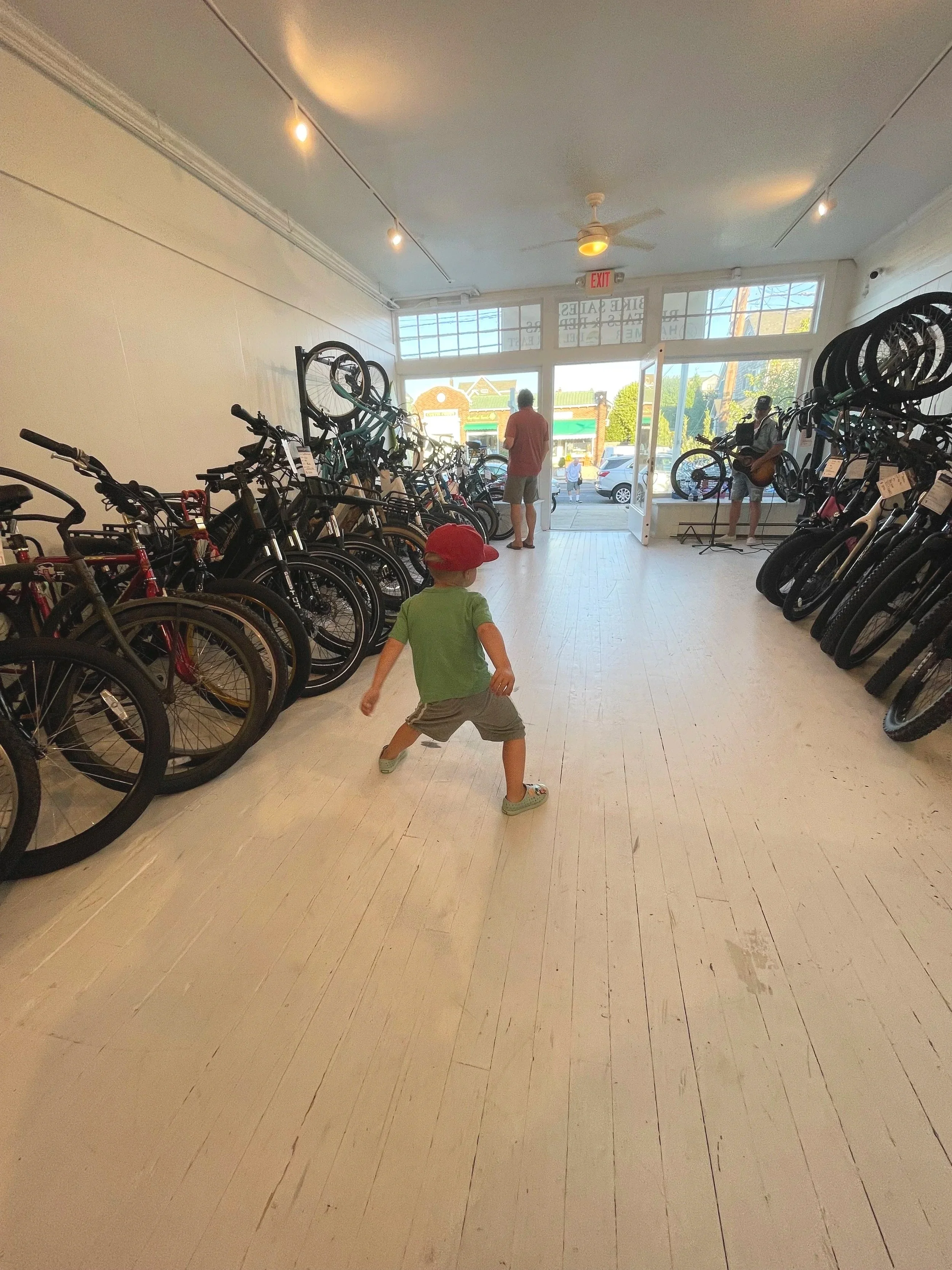 A lively moment inside the shop, surrounded by bicycles.