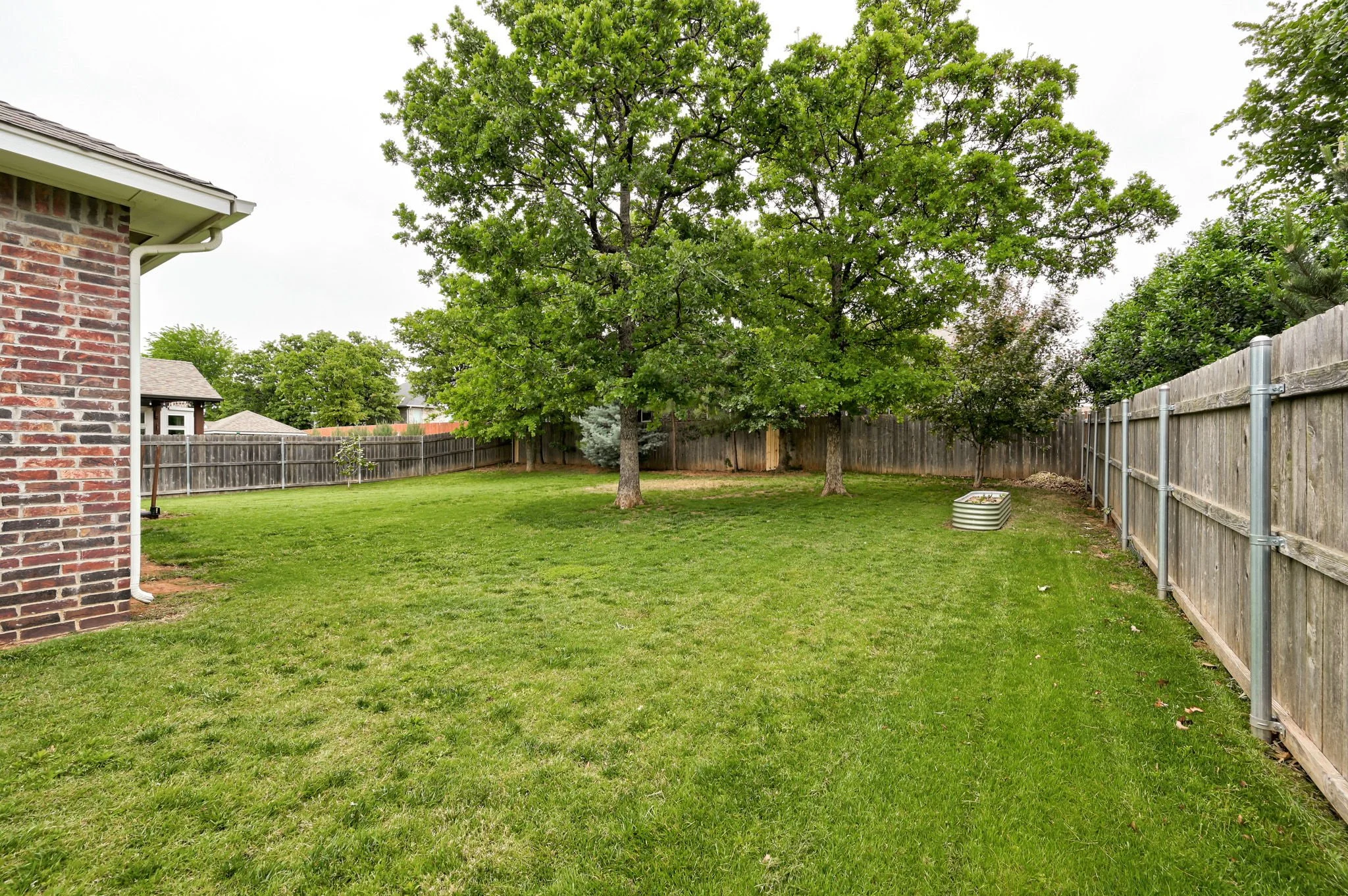 36-fenced-backyard-mature-shade-trees.jpg