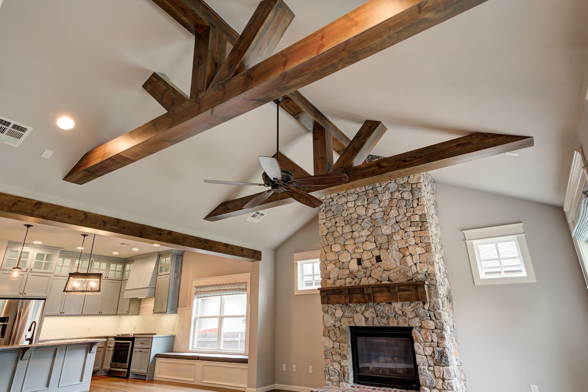 09-vaulted-wood-beam-ceiling-stone-fireplace-detail.jpg