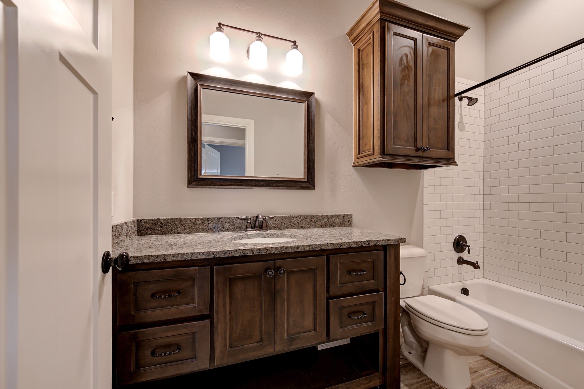 30-guest-bathroom-granite-vanity-tub-shower-combo.jpg