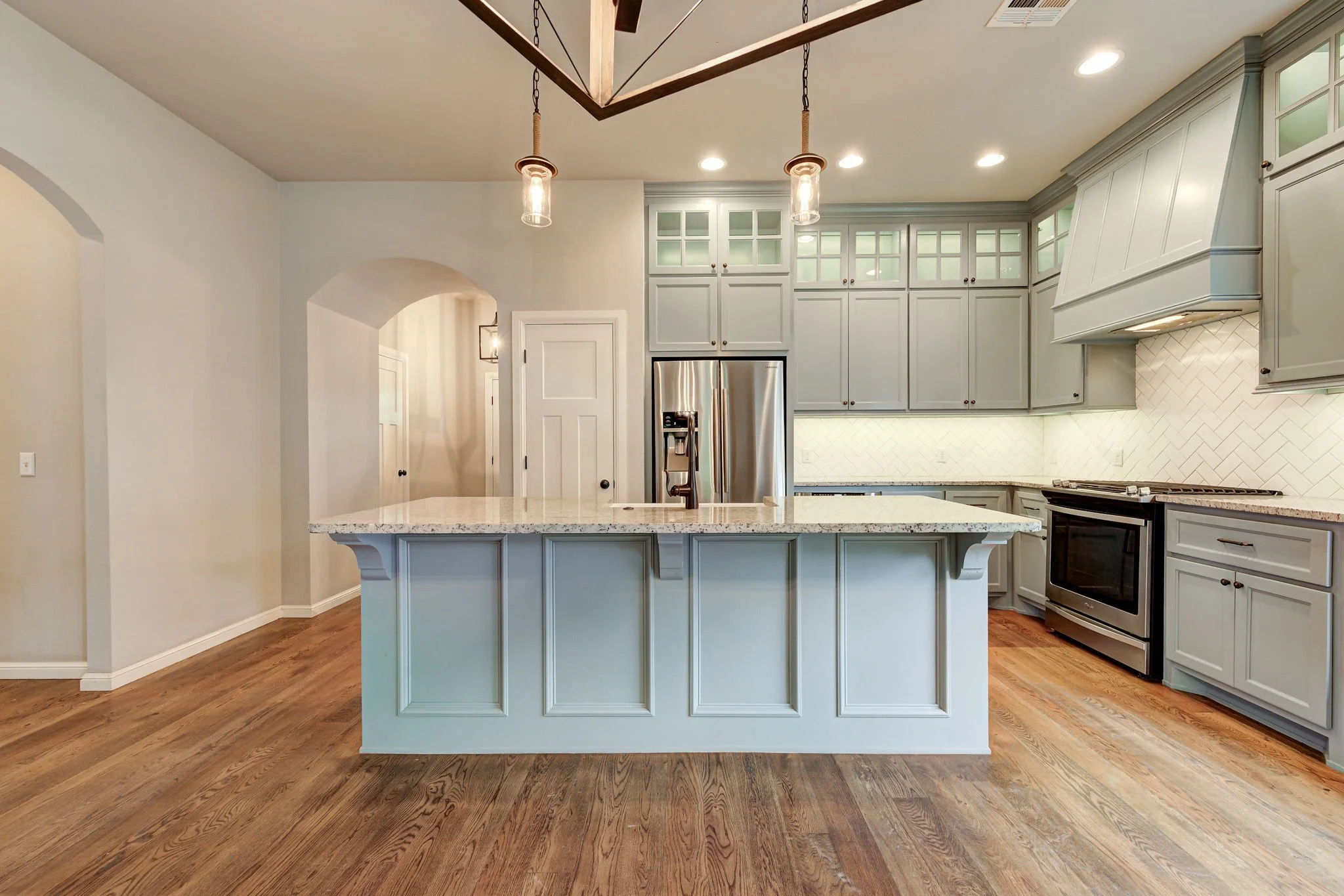 12-kitchen-island-granite-countertops-blue-cabinets.jpg