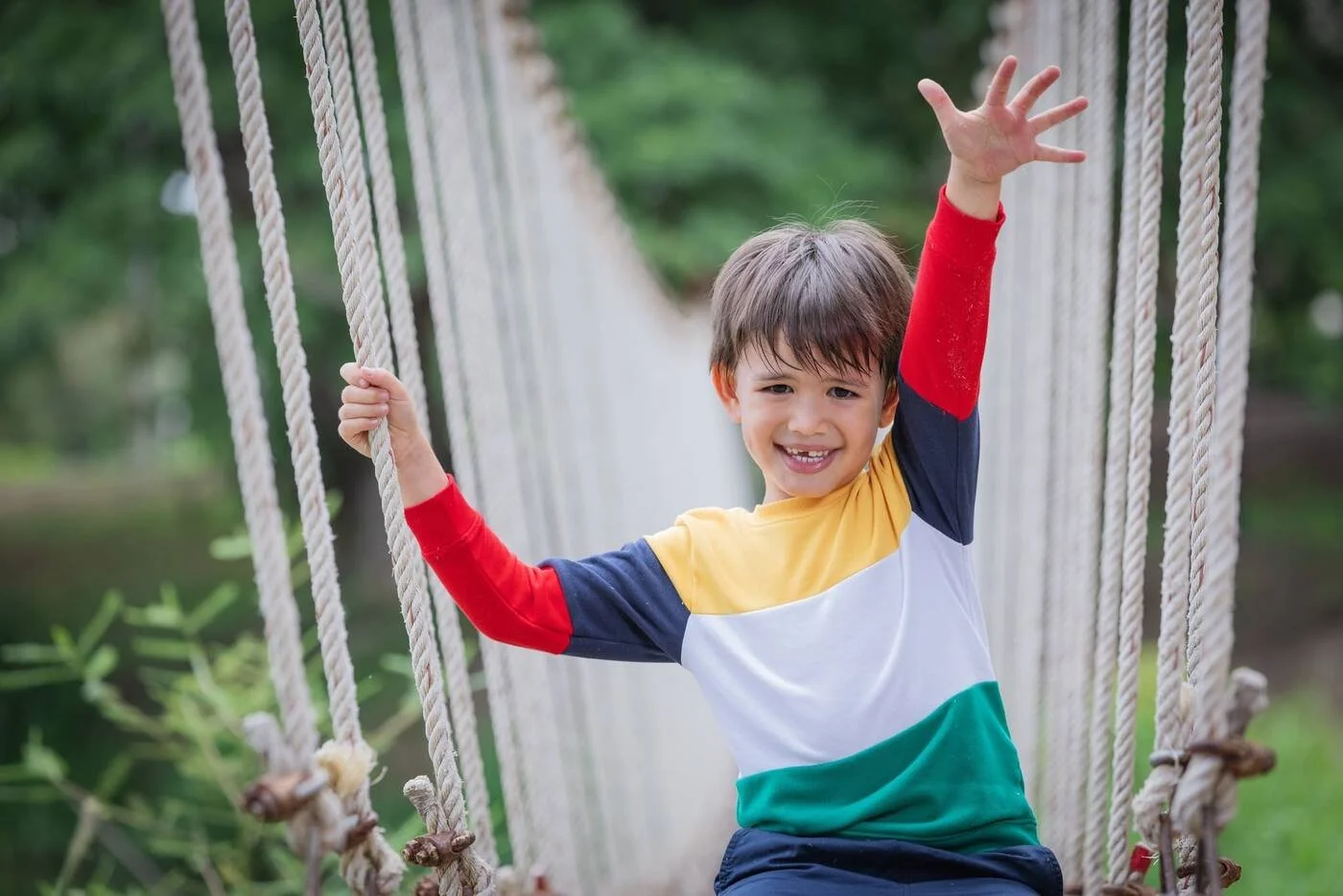 Happy child playing outdoors, reflecting the joy and growth of autism therapy in Toronto with Mini Minds