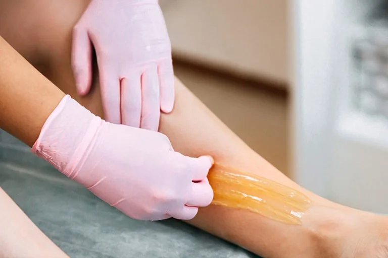Sugar paste hair removal treatment at Bare Body District, Mesa, Arizona. Expert Brazilian wax and facial wax services available. Visit us for spray tanning and hair removal services near you.