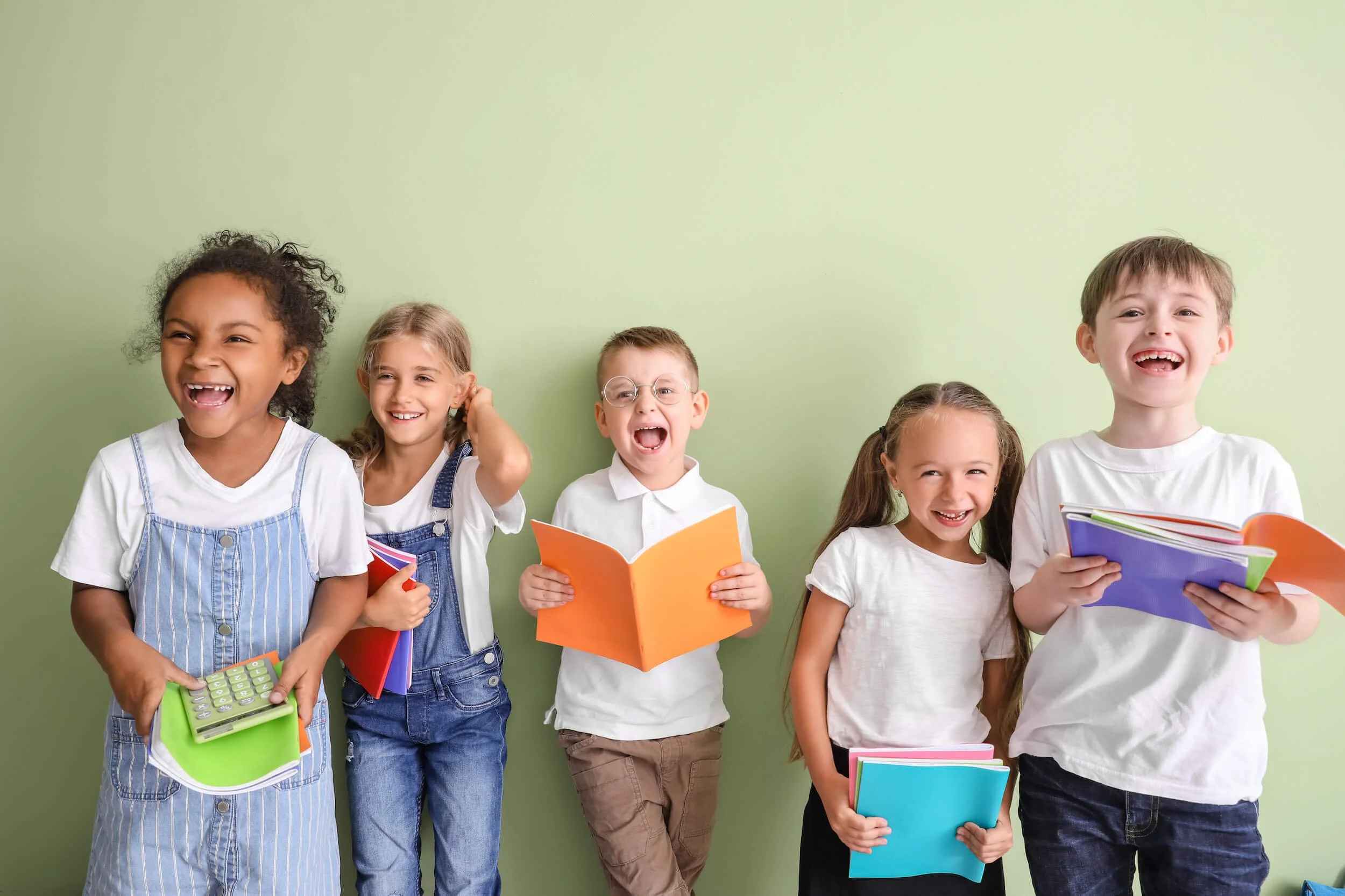 Happy second graders with books