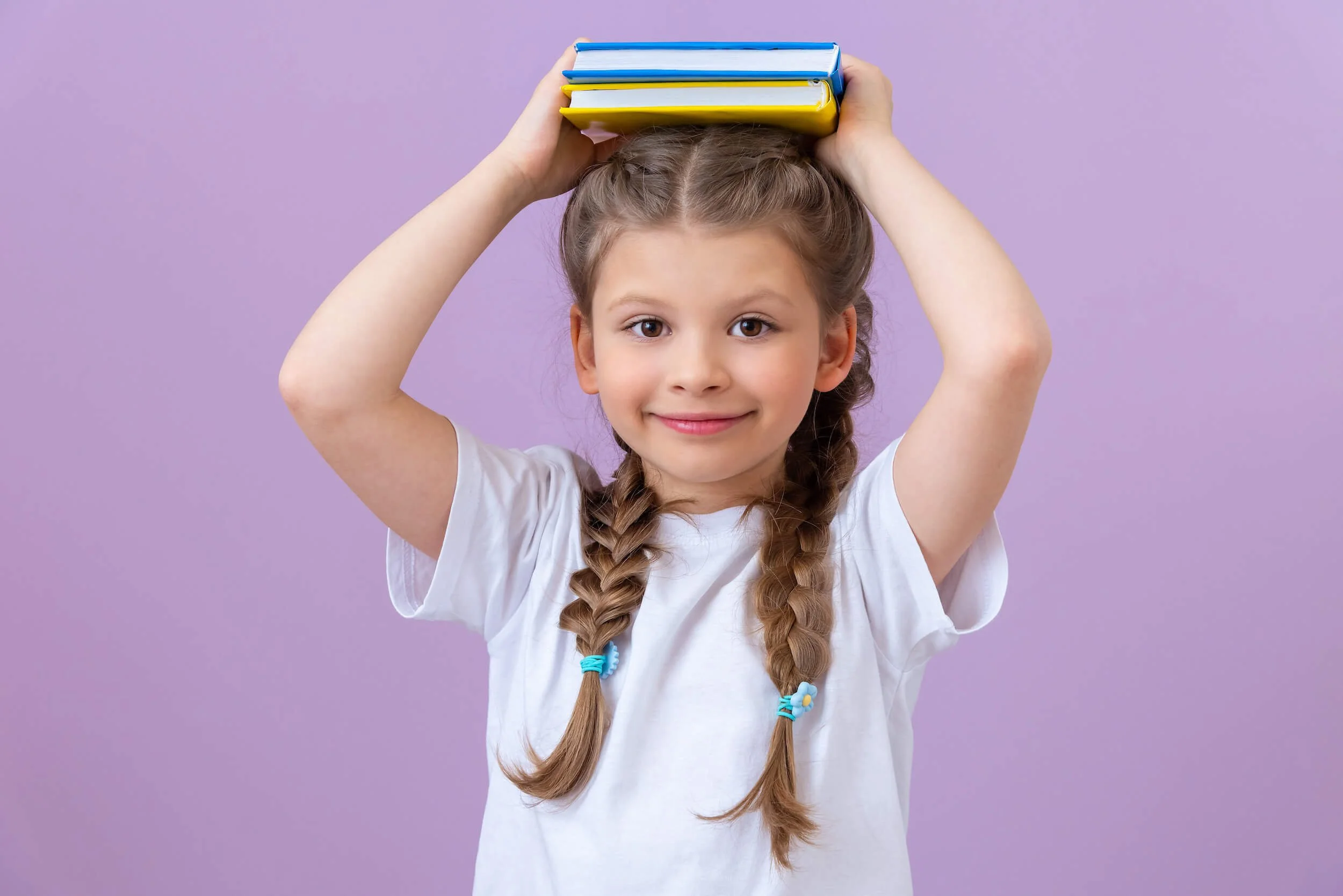 Second grader with books