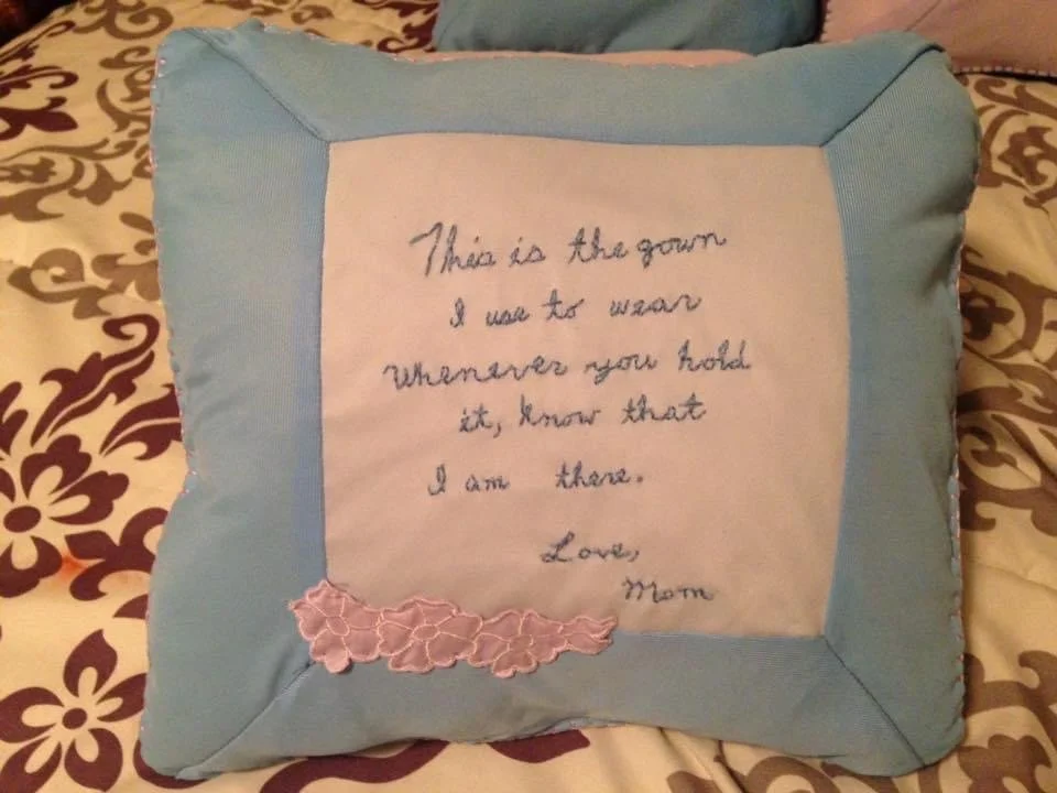 "This is the gown I used to wear - whenever you hold it, know that I am there. 
Love, Mom" 