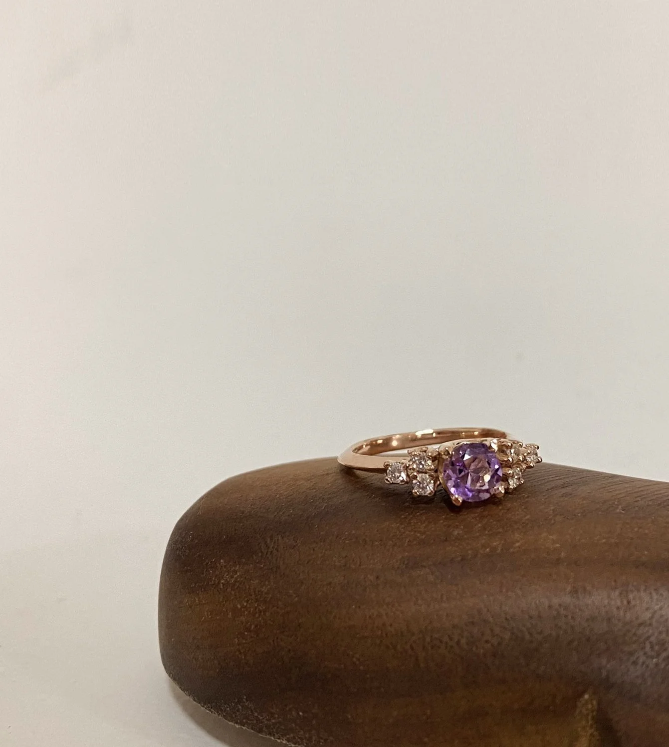 Yuyu’s Engagement Ring - 14k rose gold knife edge ring with a center stone amethyst and brilliant cut diamonds