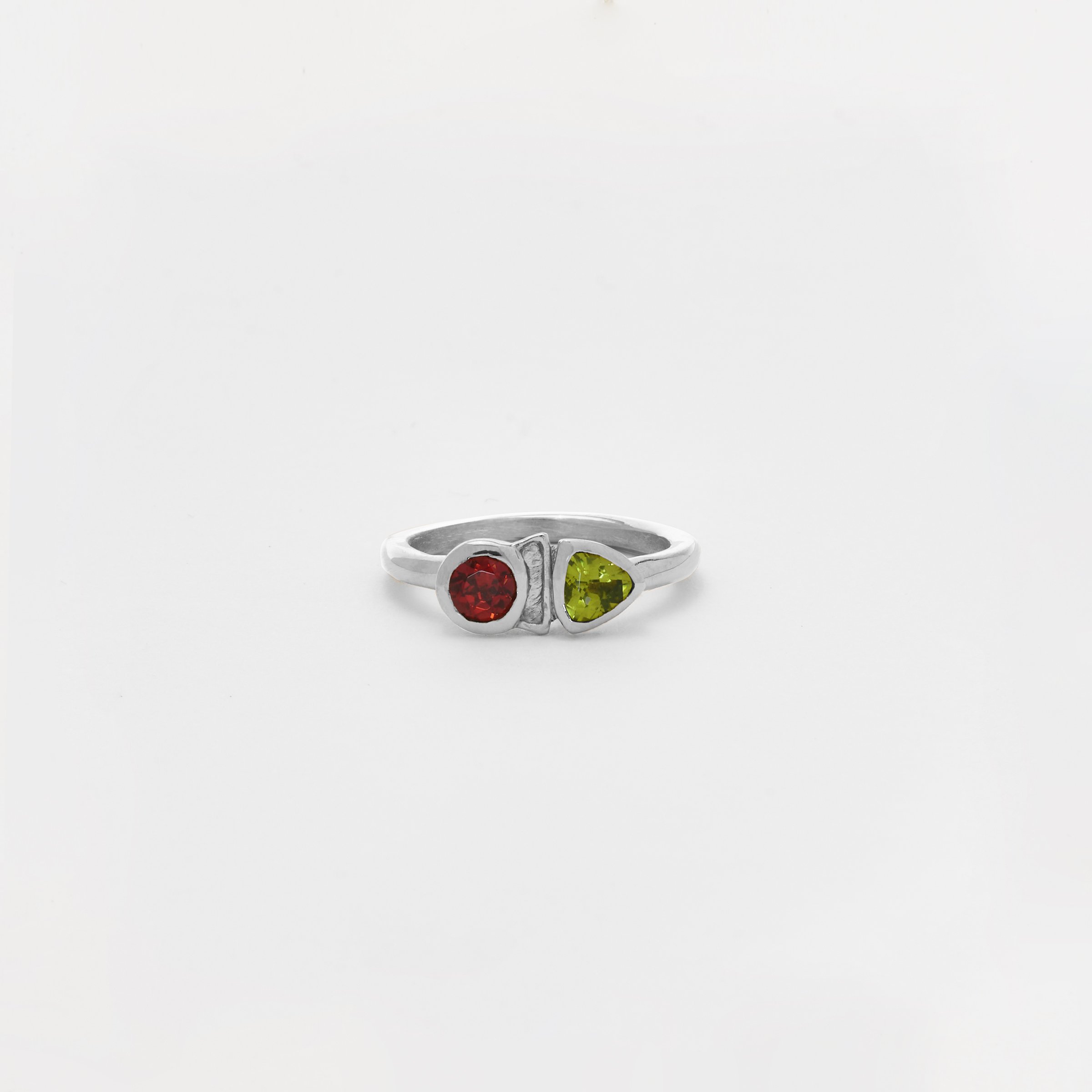 The Ofrenda Ring with Garnet and Peridot in Silver.jpg