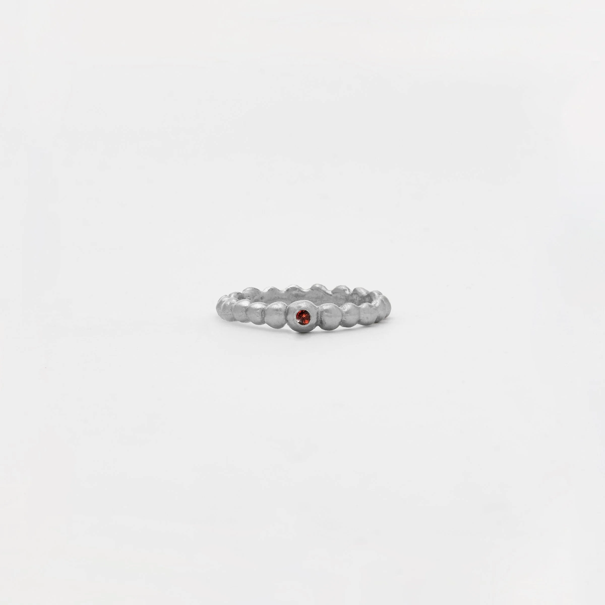 The Small Tributo Ring with Garnet in Silver.jpg