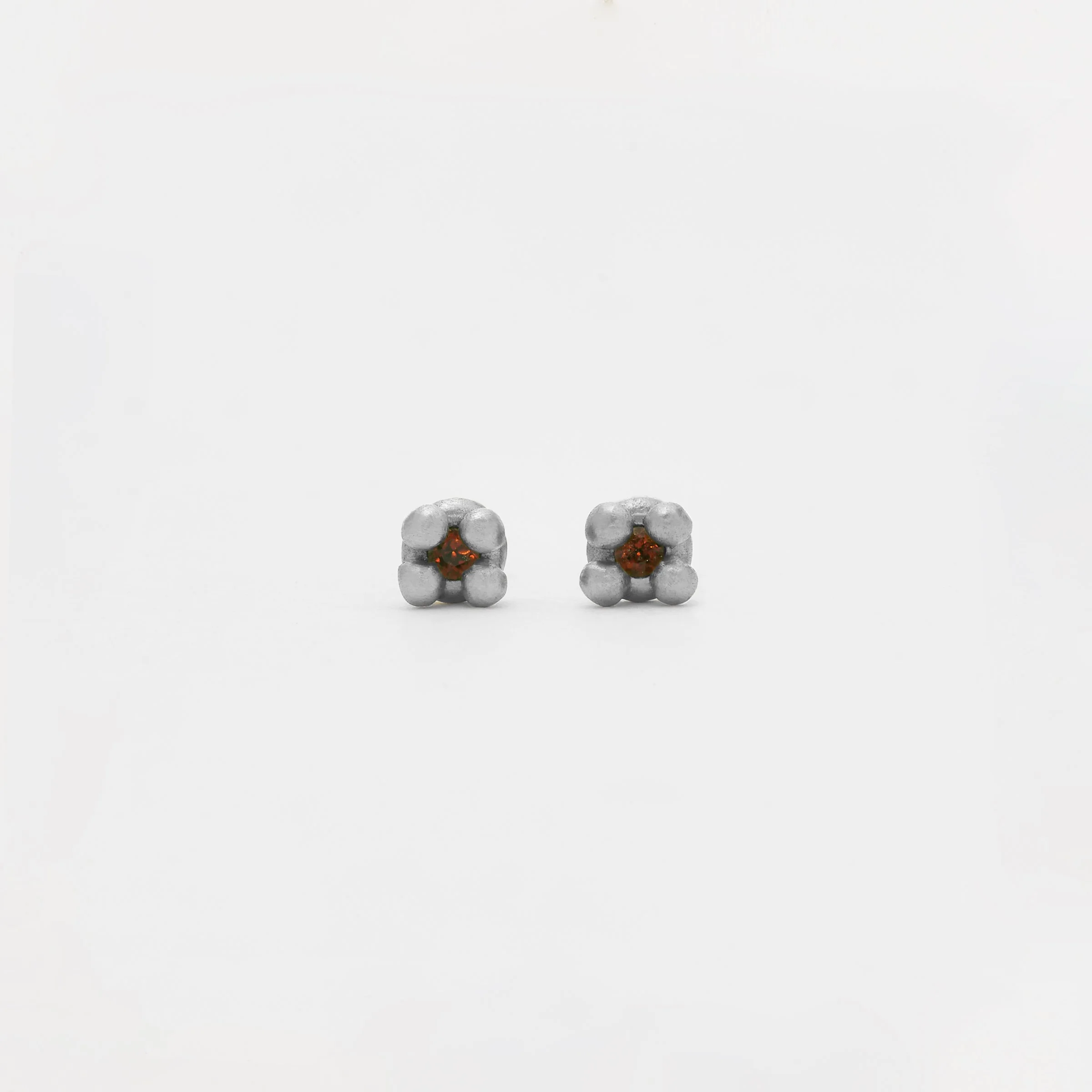 The Pilares Studs with Garnet in Silver.jpg
