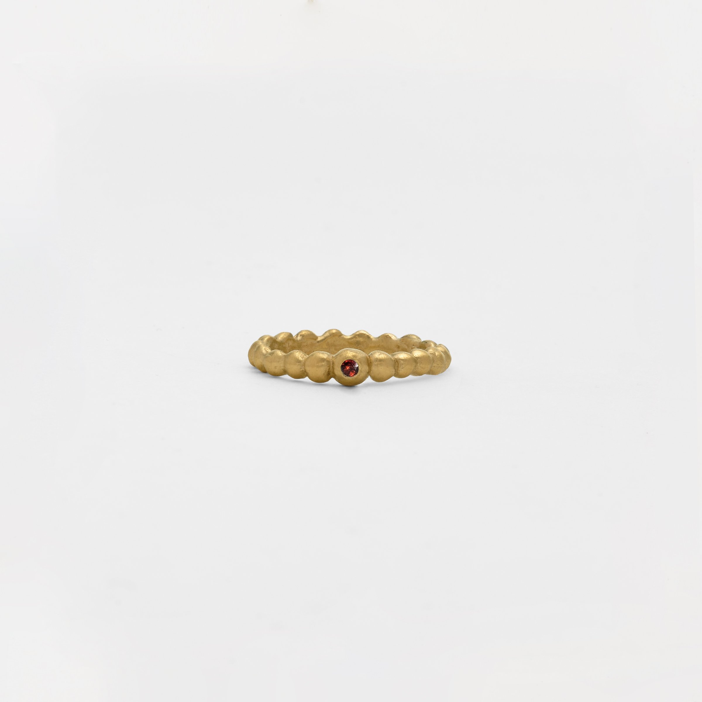 The Small Tributo Ring with Garnet in 14k Gold.jpg