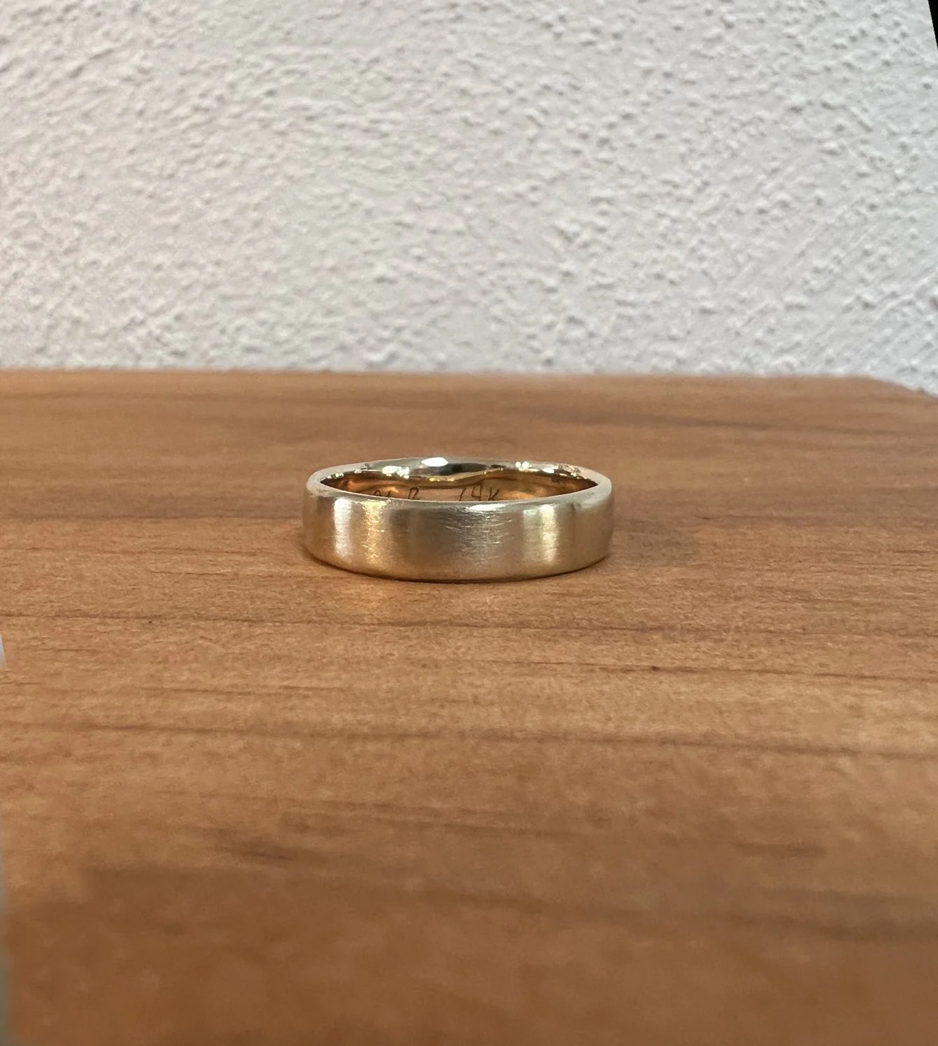 Joel’s Wedding Band - Slightly rounded edges on a 14k gold band with a satin finish and high polish interior